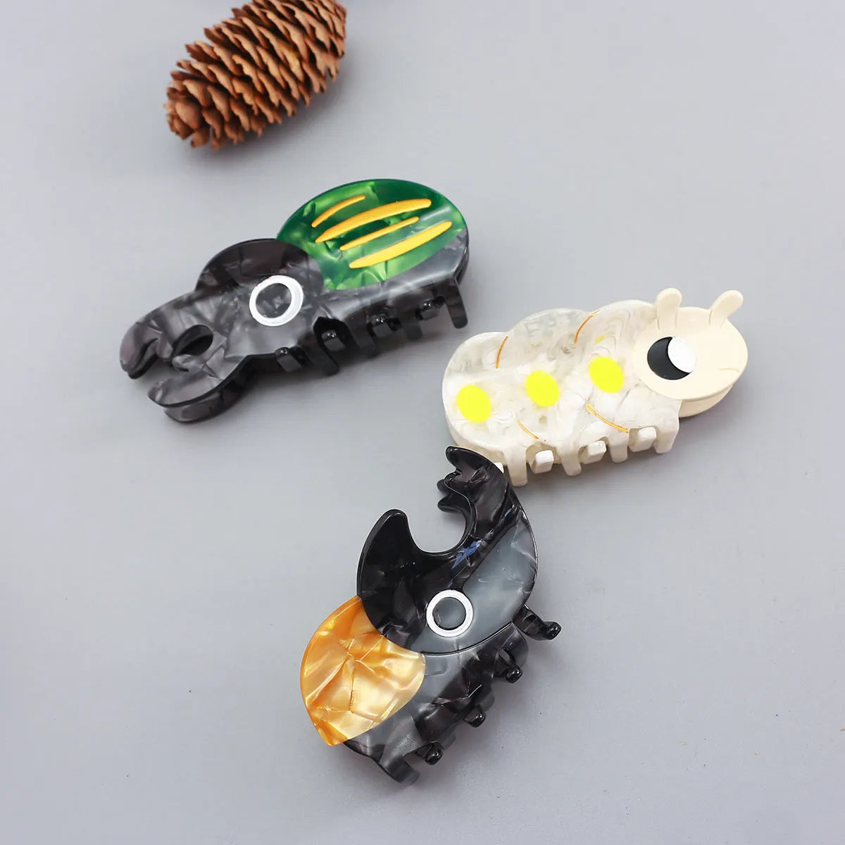 Handmade cellulose acetate beetle grip in cartoon style for insect biology observation
