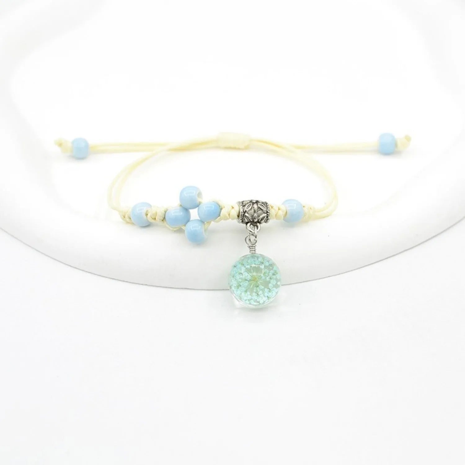 Glass bracelet with dried flowers inside 1.4cm beads on lace-style band in multiple colour options