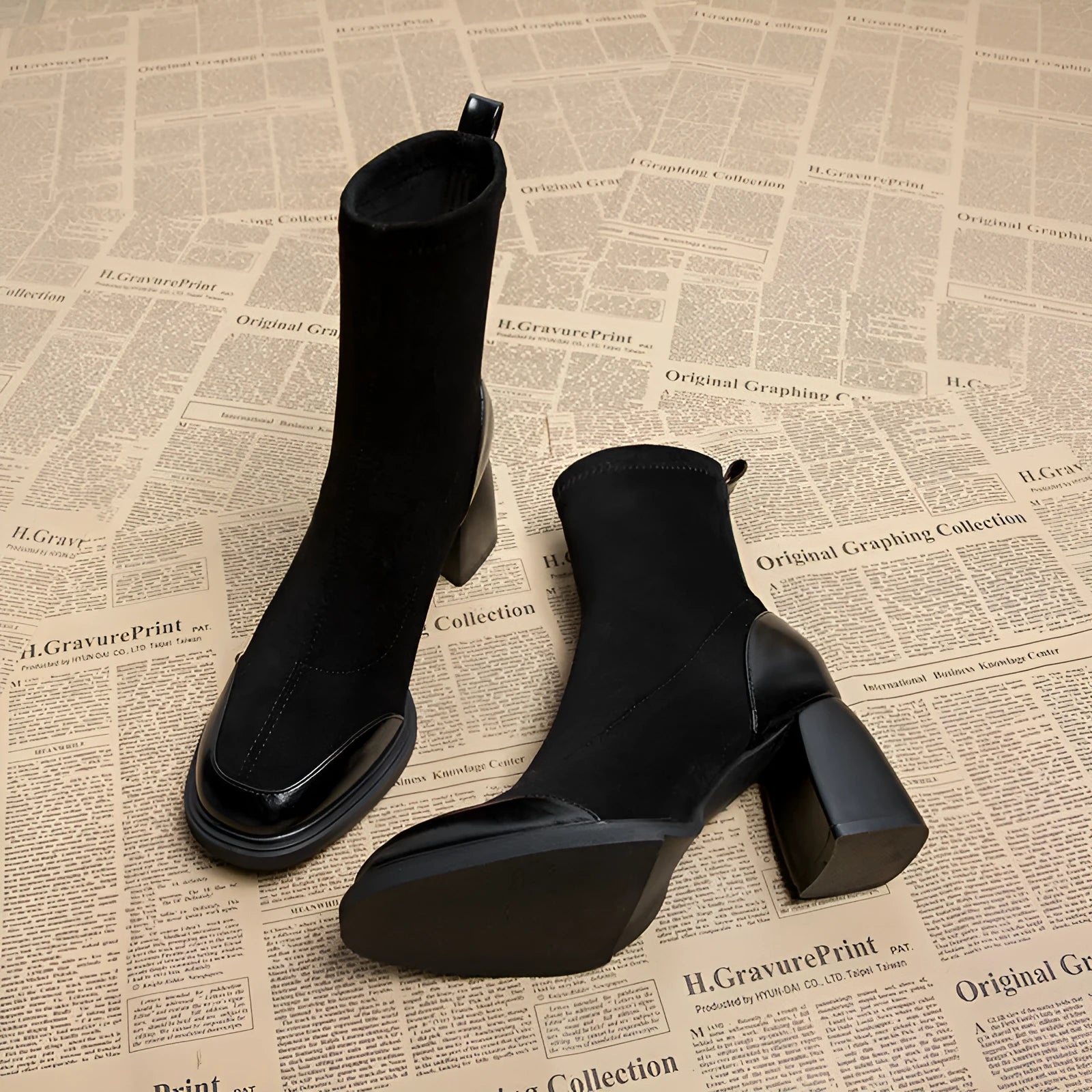 Genuine leather women's short martin boots in black matte finish with high heel and rubber sole