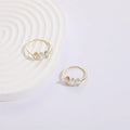 Geometric triangle ring with horse eye tricolor zircon in electroplated 14k gold colour on copper