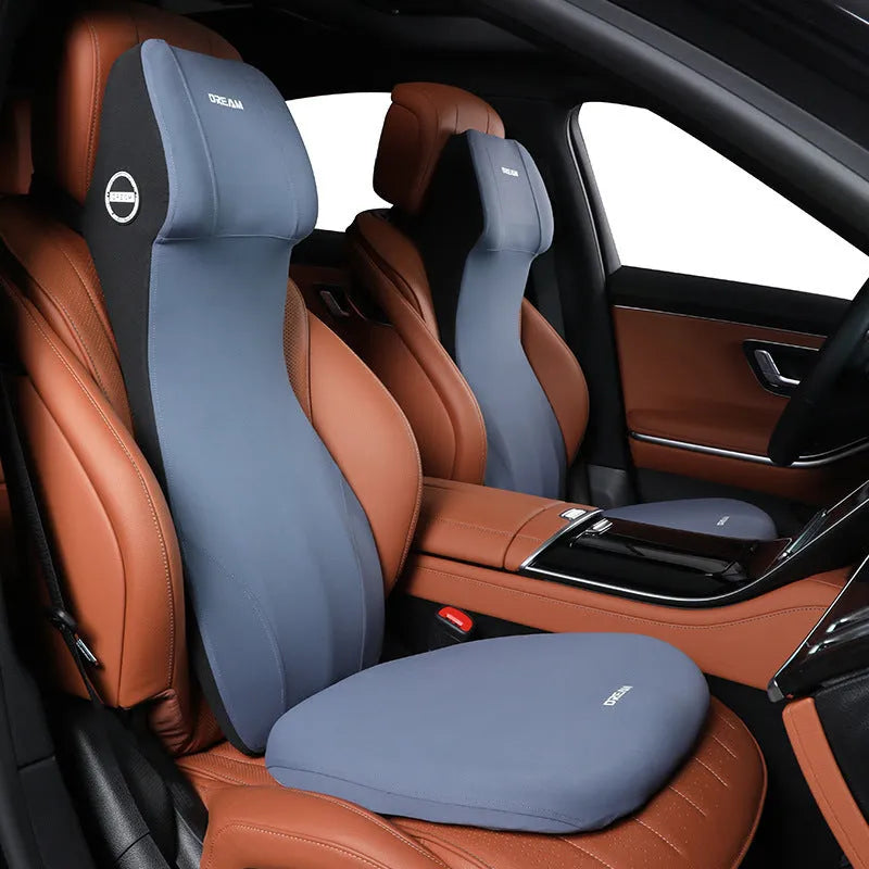 Black automotive memory foam waist cushion and headrest lumbar support pillow on a car seat.