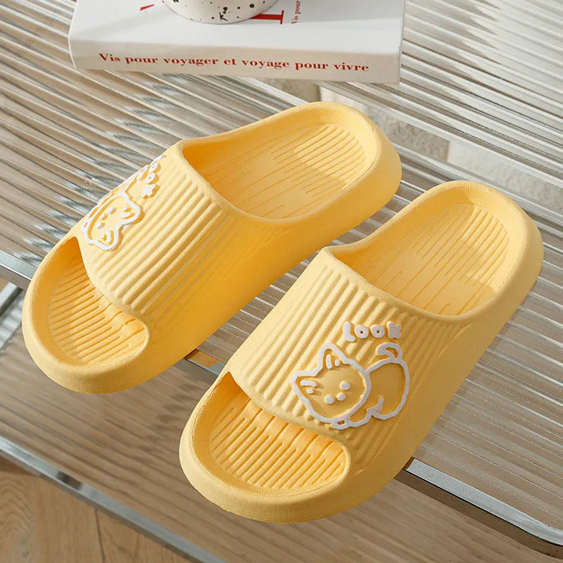 Women's green cat slippers with thick EVA platform sole on a wooden floor