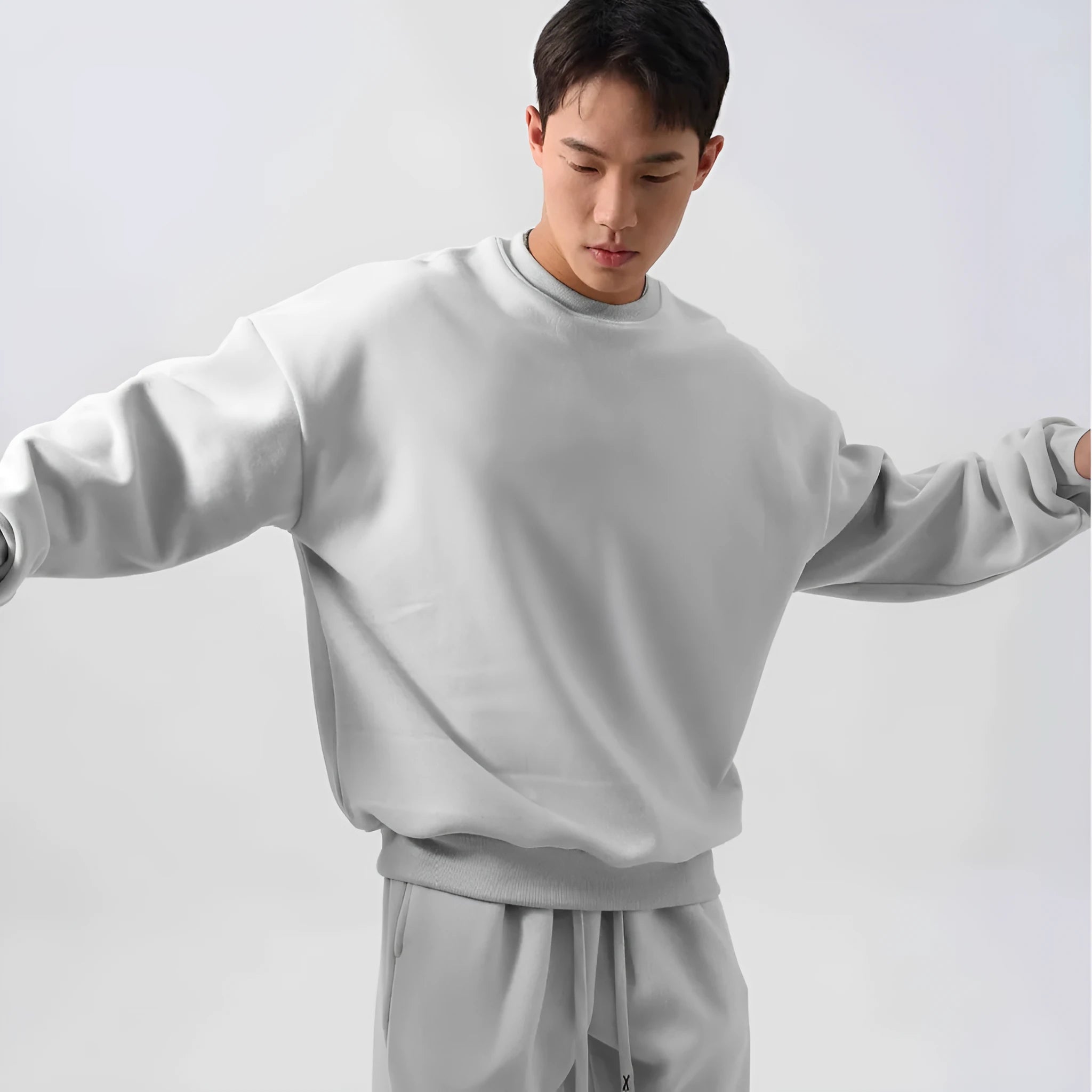 Men's black polar fleece tracksuit with crew neck jacket and matching padded trousers