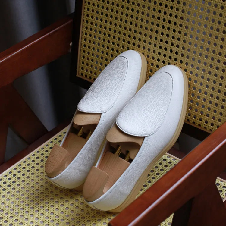 British handmade brown leather loafers for men on a white background