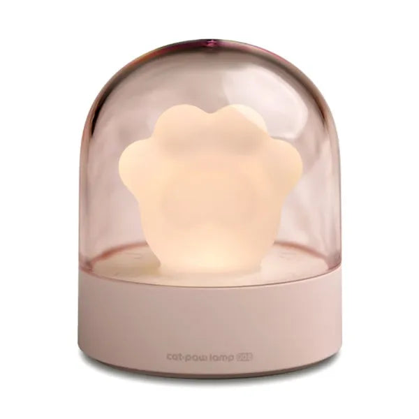 Grey cat paw shaped USB night light with rotating soft light and music box function on wooden desk