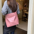 Corduroy one-shoulder commuter bag with pink or brown colour options showing 39cm length dimension