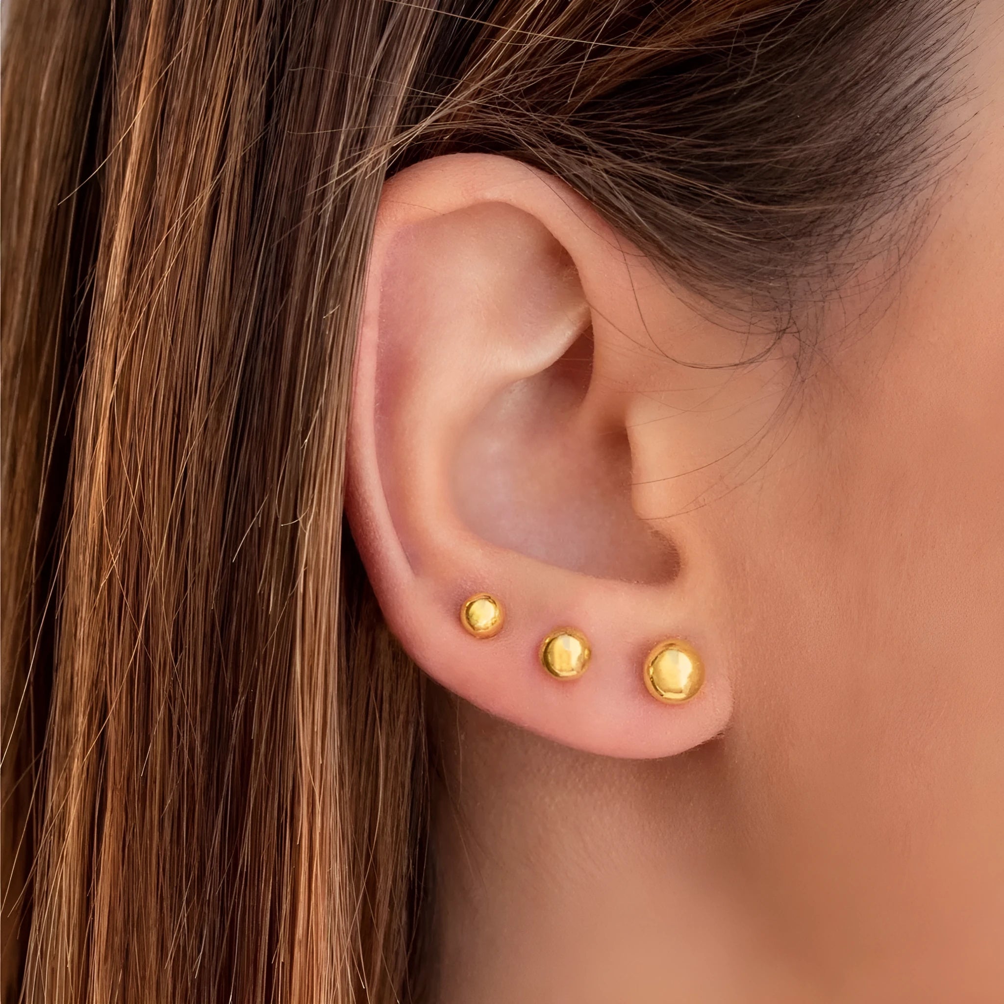 Stainless steel minimalist ball stud earrings in gold or silver, showing size comparison of 3mm, 4mm, 5mm and 6mm balls.