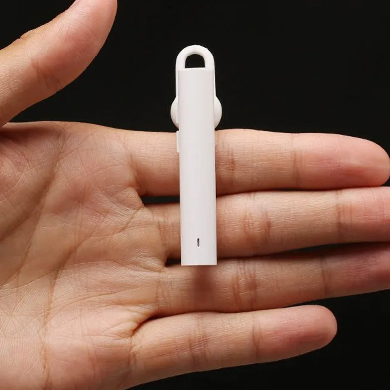 Compact wireless Bluetooth headset in Black, 5.6 cm long, with earpiece and charging port visible