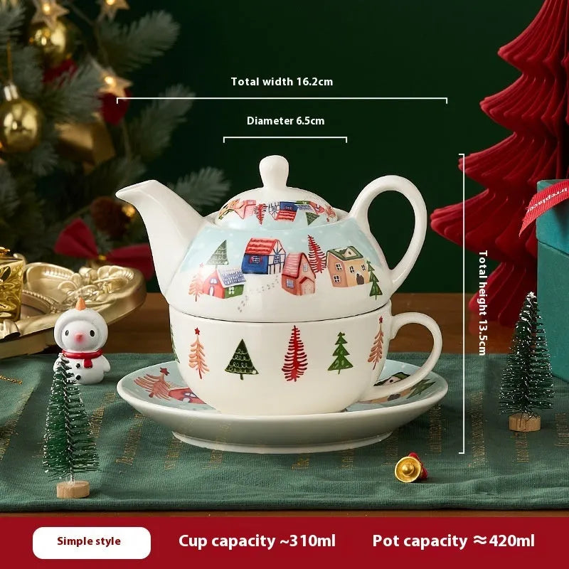 Ceramic gold-plated Christmas teapot set with snowflake design, including pot on dish and cup on dish with spoon, in gift box.