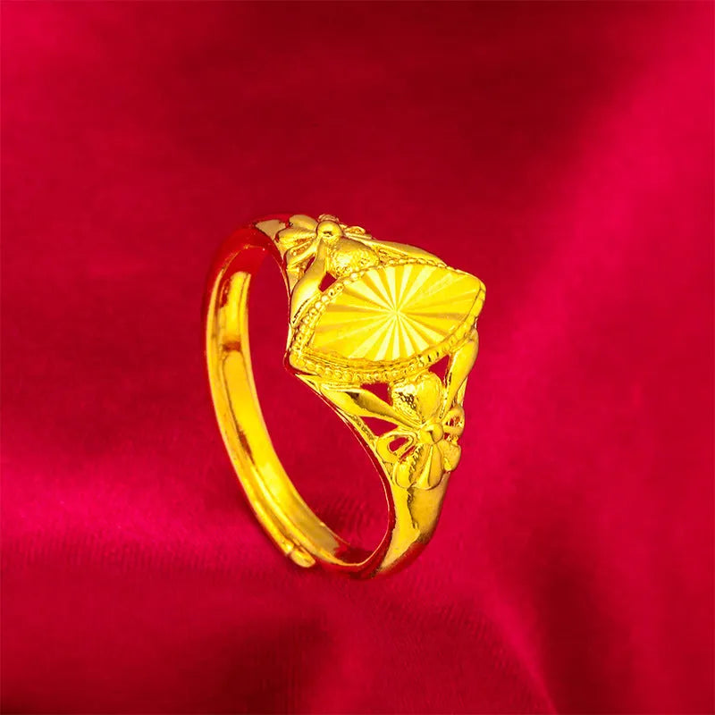 Gold open geometry ring with diamond flower pattern and textured botanical detailing