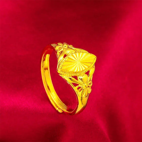Gold open geometry ring with diamond flower pattern and textured botanical detailing
