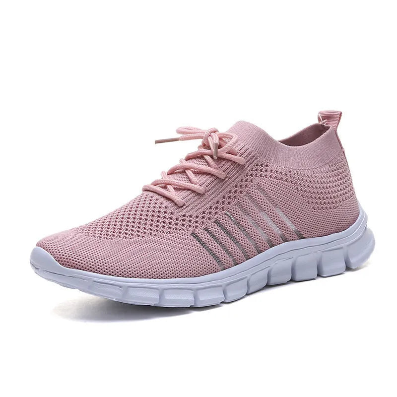 Breathable women's casual flat shoes in flying knit mesh with front lace tie.