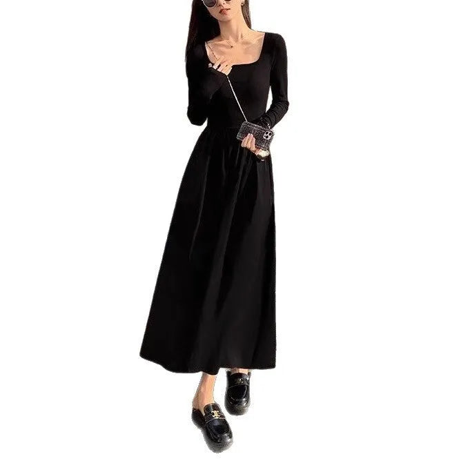 Women's black knitted dress with square collar, long sleeves, elastic waist, and A-line long skirt