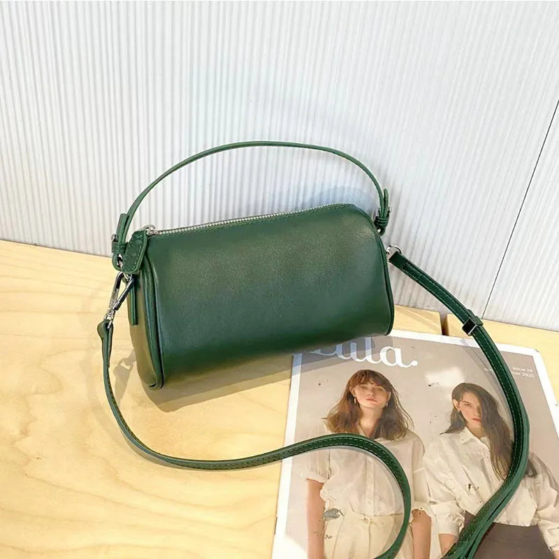 Genuine leather cylindrical crossbody phone bag in vegetable-tanned leather with single shoulder strap