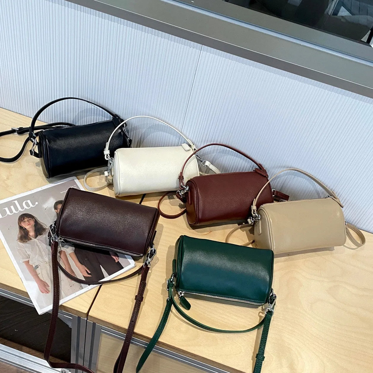 Genuine leather cylindrical crossbody phone bag in vegetable-tanned leather with single shoulder strap