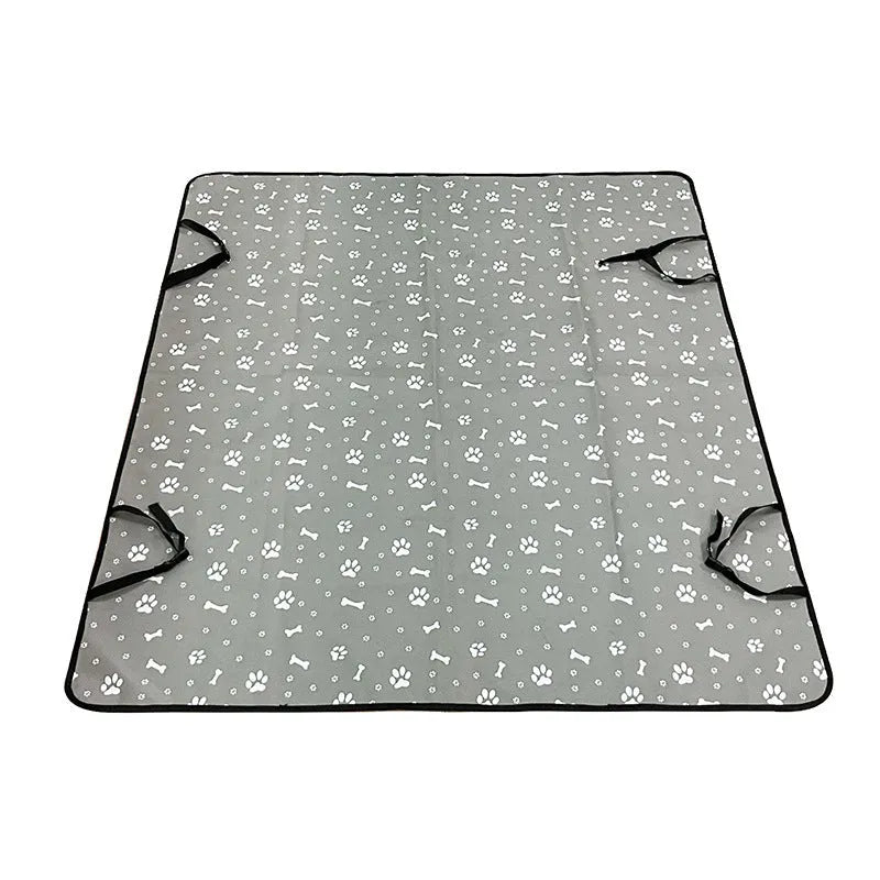 Grey dog bone print water resistant car pet mat measuring 140x110cm on a car rear seat.