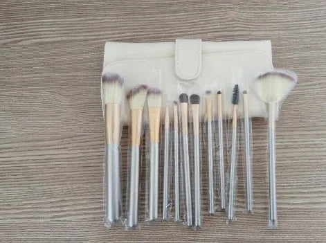 Persian makeup brush set with rice white bristles and champagne handles, shown in a 12-piece kit.