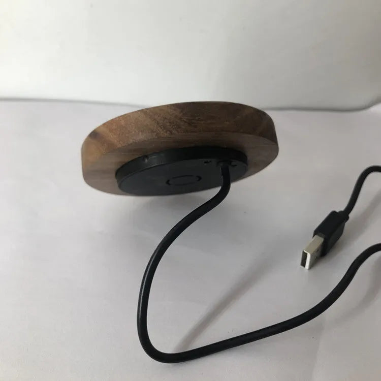 Round hidden wireless phone charger for desk or table installation, shows 60mm and 75mm size options.