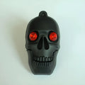 Skull skeleton shaped USB flash drive on a keychain, showing front and side views.