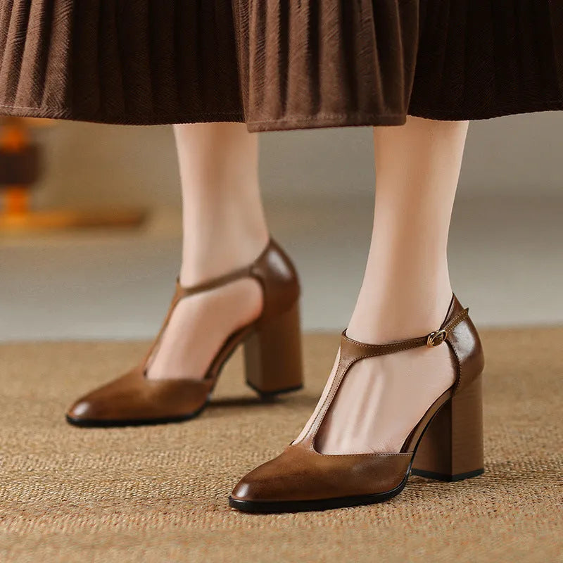 Women's dark brown retro pointed toe Mary Jane shoes with a buckle strap and hollow baotou design.