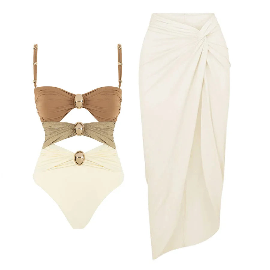 Women's solid-colour one-piece swimsuit with detachable skirt and gold button details in assorted colours.