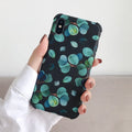 Black silicone iPhone case featuring a raised leaf pattern design.