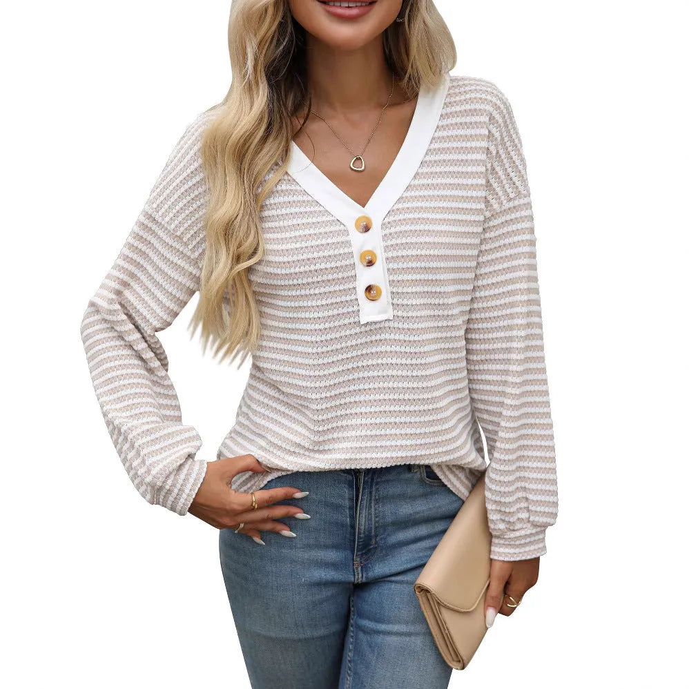 Women's loose fit V-neck pullover top with long sleeves and patchwork detail in a colour selection.