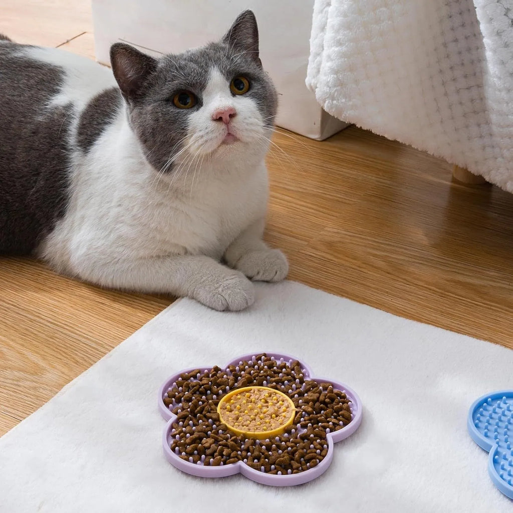 Flower-shaped silicone pet licking mat with suction cups on back in blue, grey, pink, purple, or red