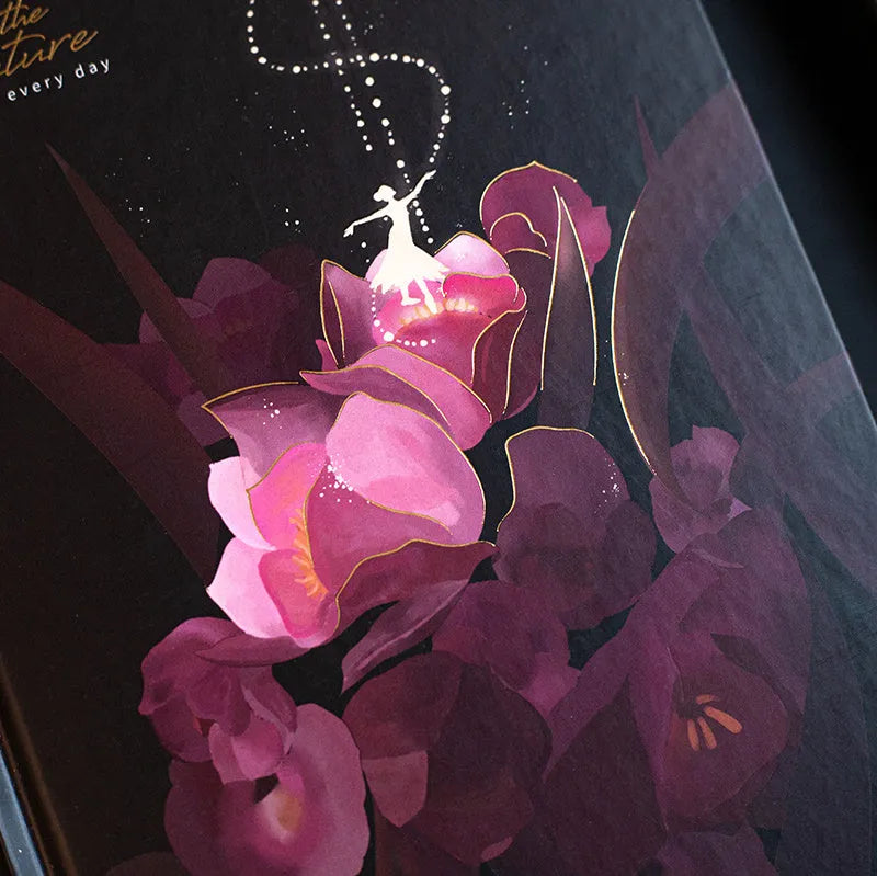 A5 notebook with luminous cover showing colour illustration pages inside, available in Deep Blue, Gold, Light Blue, or Purple colours