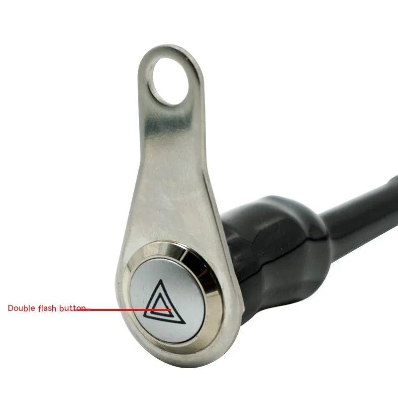 Black stainless steel motorcycle double flash switch with a central button and illuminated light ring.