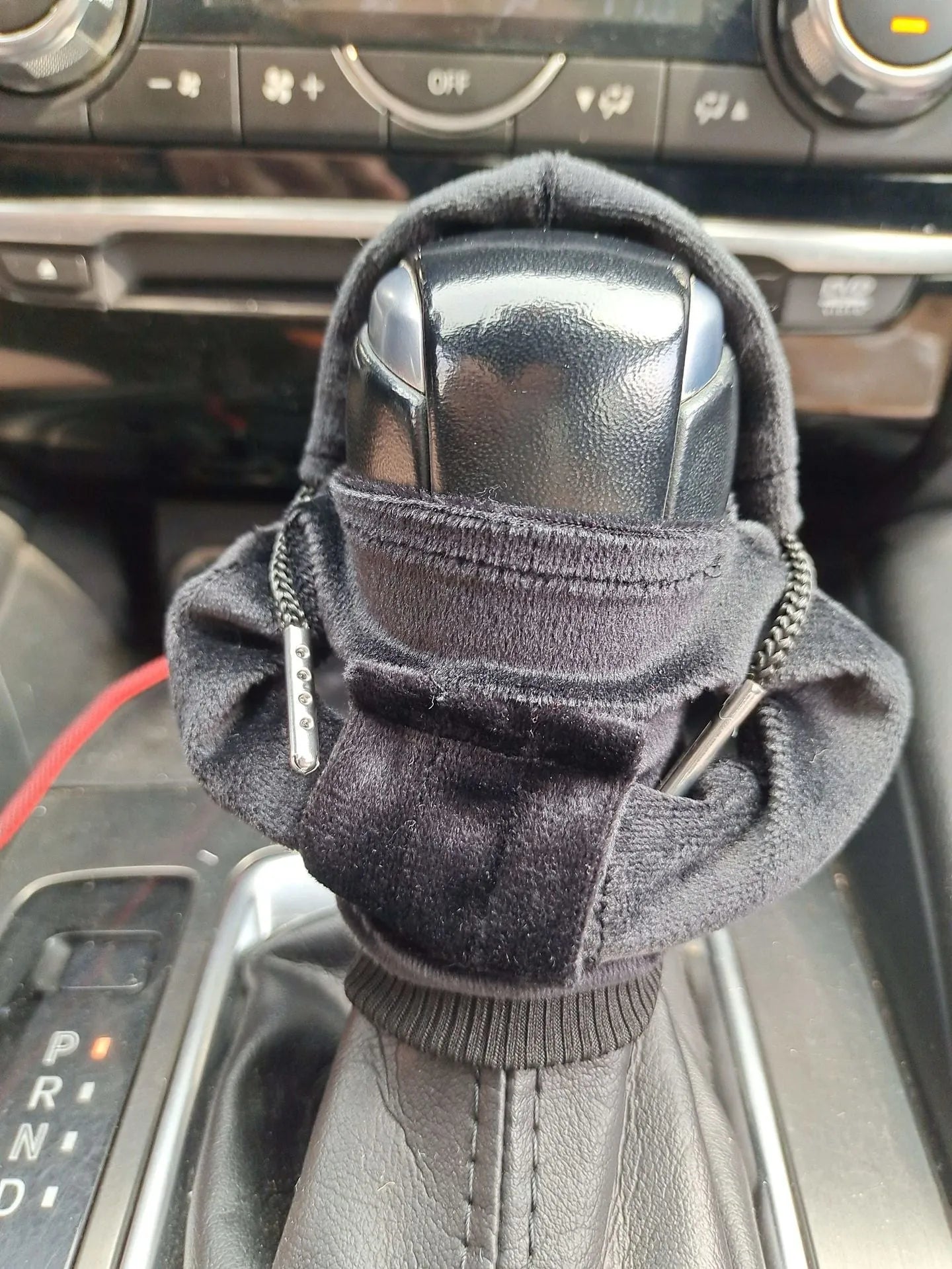 Pure cotton gear lever sweater decoration in multiple colours on a car gear knob.