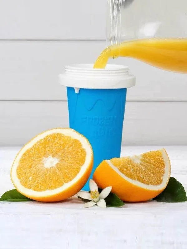 Blue double-layer silicone pinch cup for fast drink cooling, shown next to a smoothie.