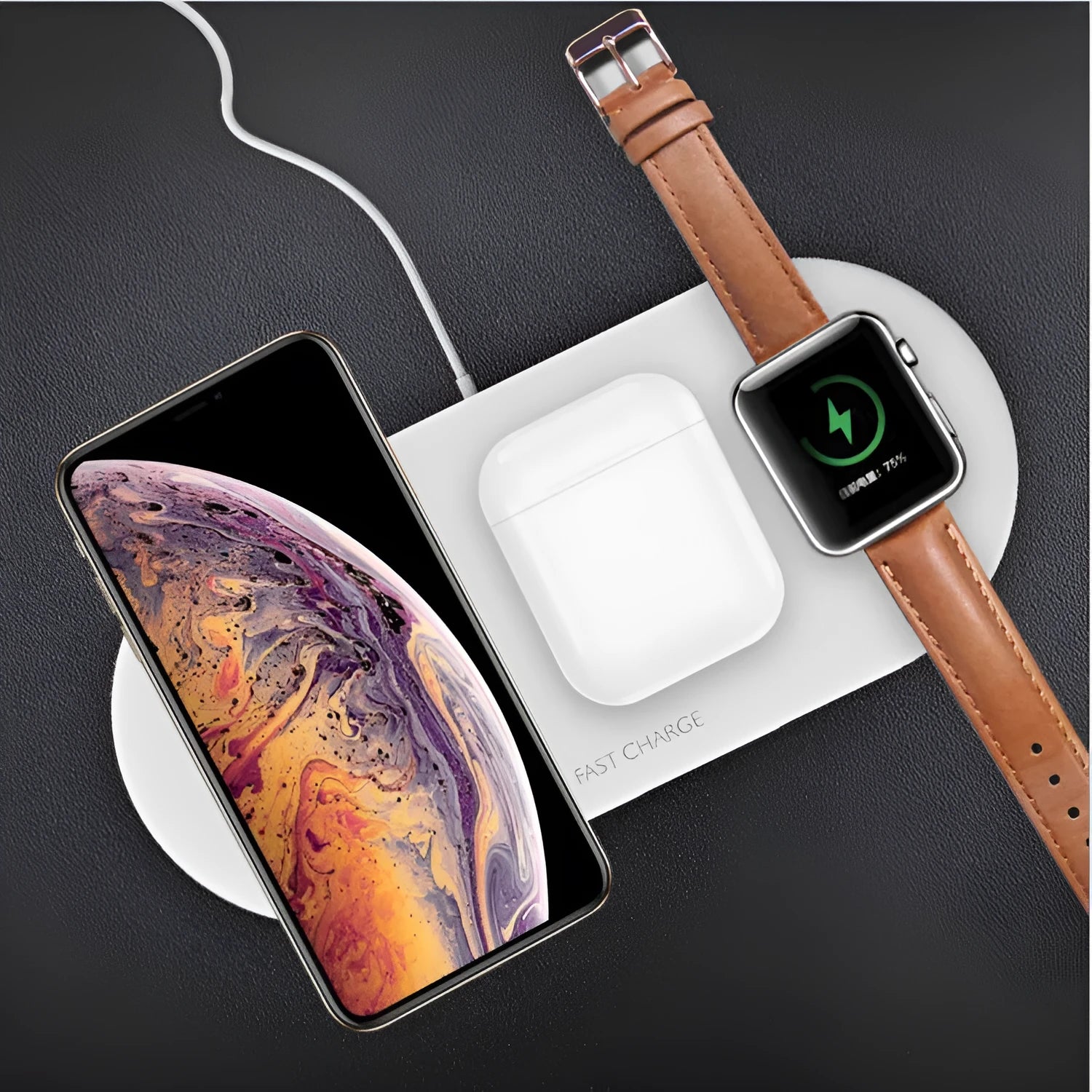 Black and white 3-in-1 wireless charging station for iPhone, Apple Watch and AirPods on a desk.