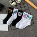 10 pairs of white cotton tube socks with graffiti pattern, middle calf length, on a plain background