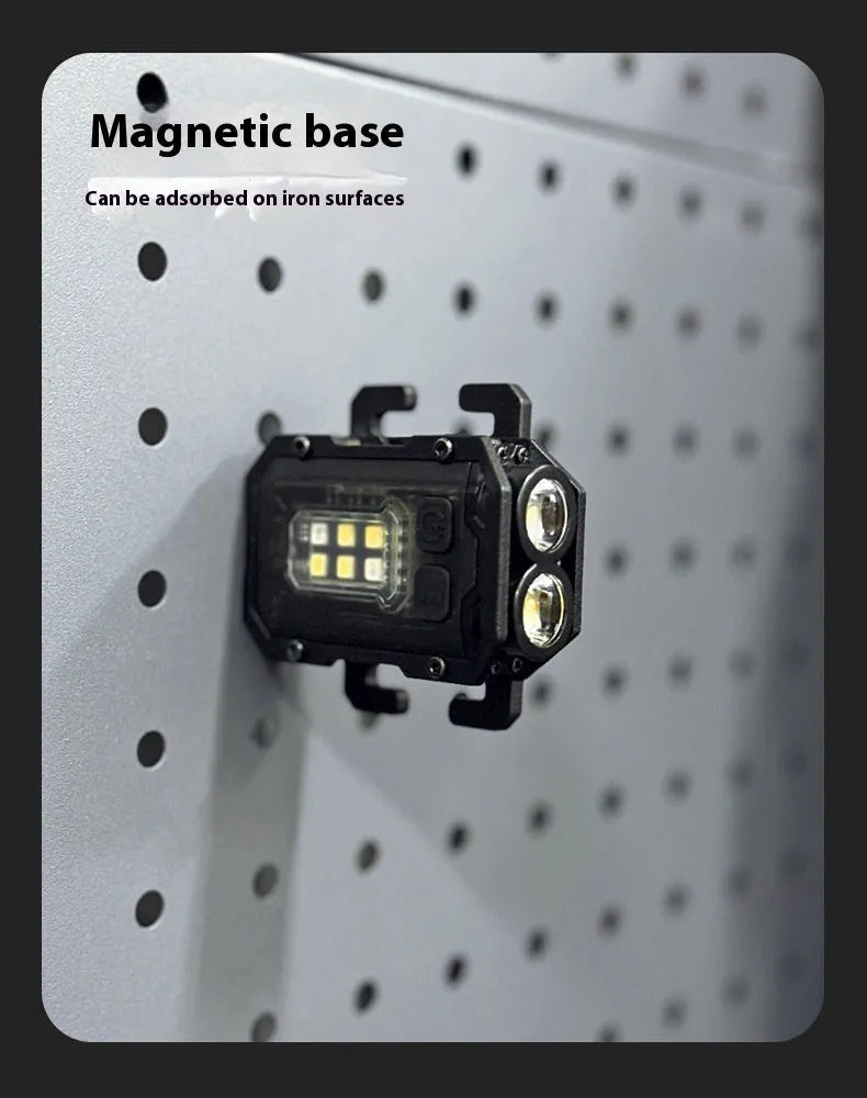 Mini black tactical warning flashlight with USB charging cable for backpack mounting.