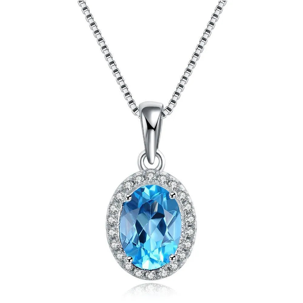 925 sterling silver jewellery set with blue topaz gems showing geometric patterned necklace, earrings, ring and pendant