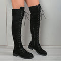 A pair of black lace-up over-the-knee boots with a round toe and flat rubber sole on a white background.