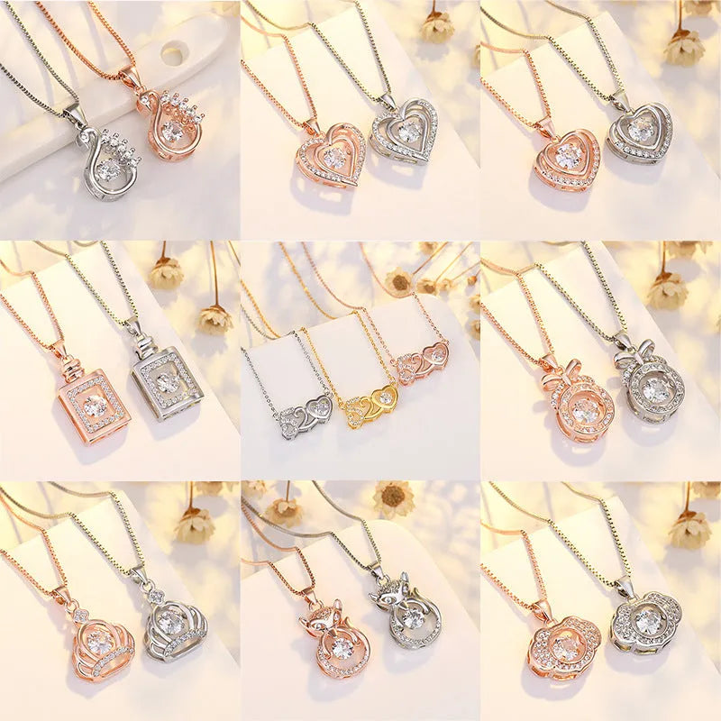 Sterling silver heart necklace with crown and bow decorations in silver and rose gold finishes