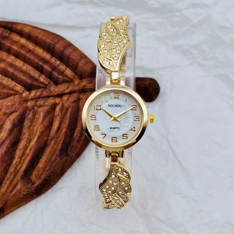 Women's stainless steel watch with round dial showing gold face colour option