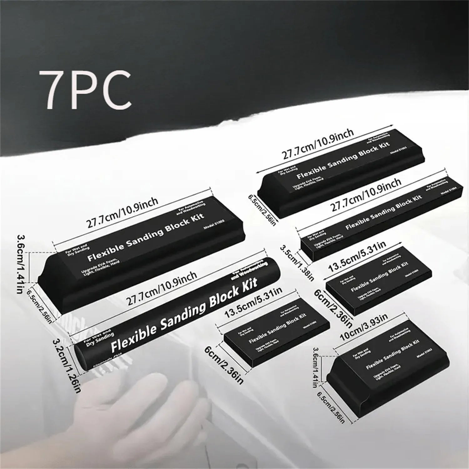Set of seven black metal frosted blocks arranged together on a surface.