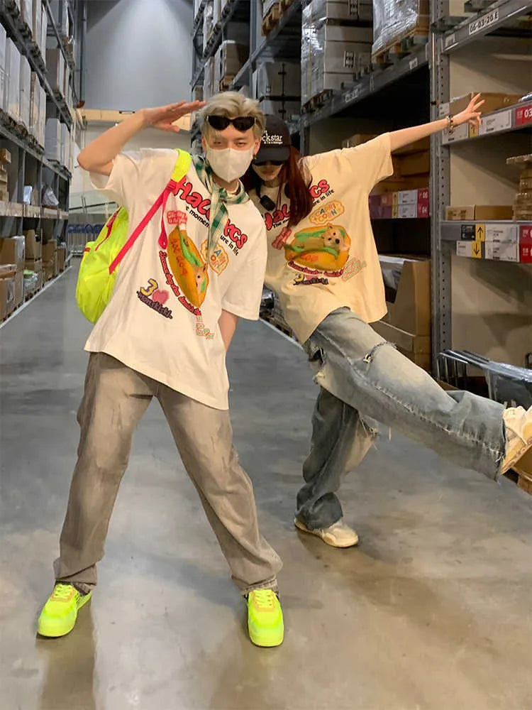 Cartoon hamburger dog printed loose-fit cotton t-shirt in apricot on a model.