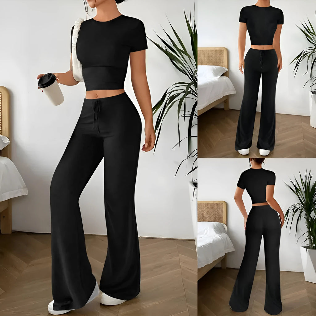 Black polyester women's high waist trousers and short sleeve t-shirt suit on hanger