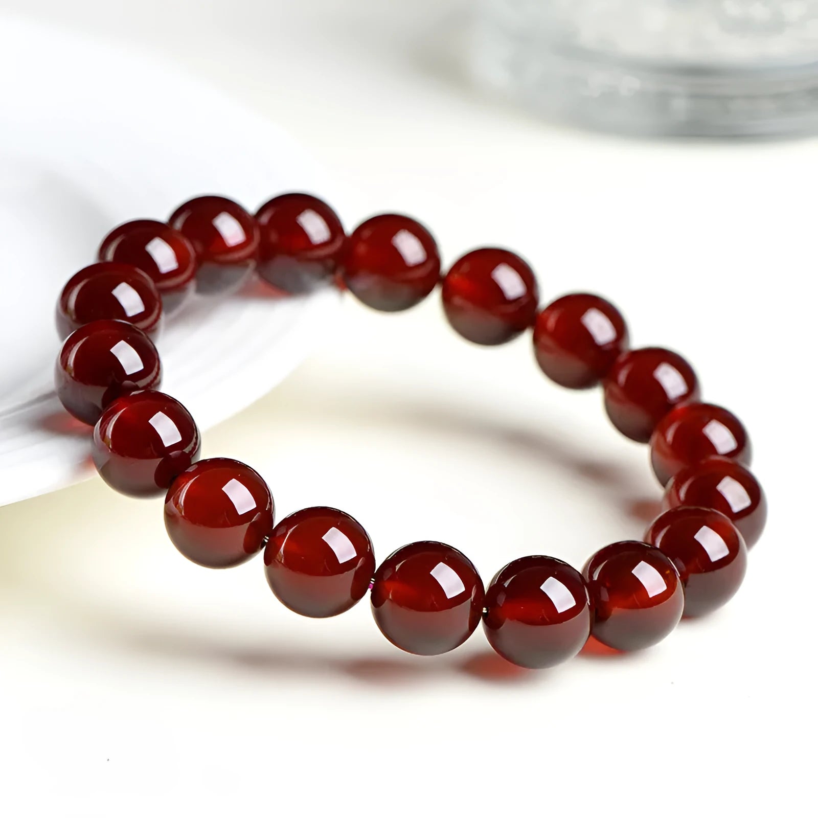 Natural orange red garnet ball crystal bracelet with Ruyi design element in unisex retro style