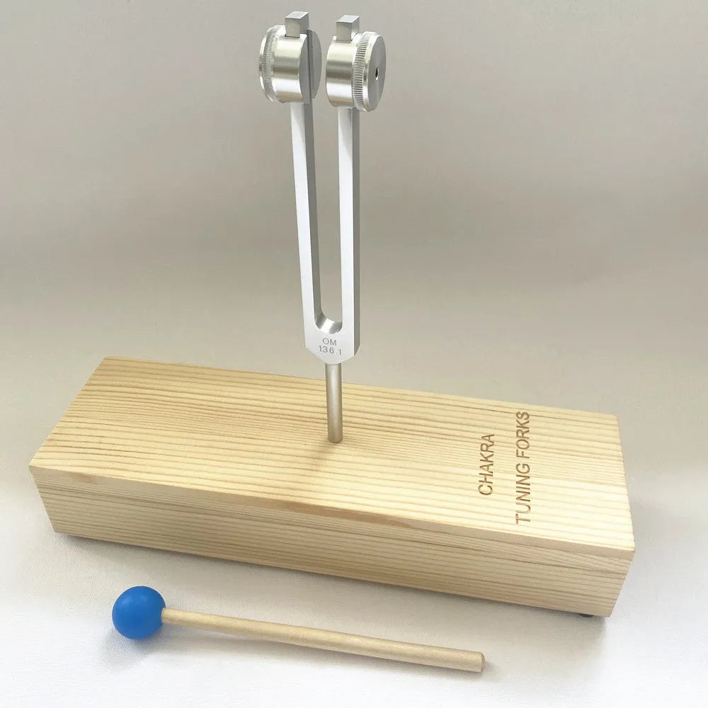 Aluminium alloy 432Hz tuning fork with speaker on kraft paper box background