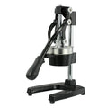 Black and white manual cast iron juice press with stainless steel funnel, 40cm tall.