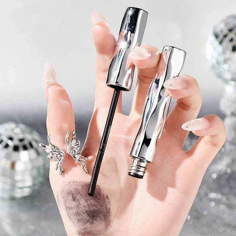 Waterproof mascara in steel tube with black and brown colour options shown with eyelash curler