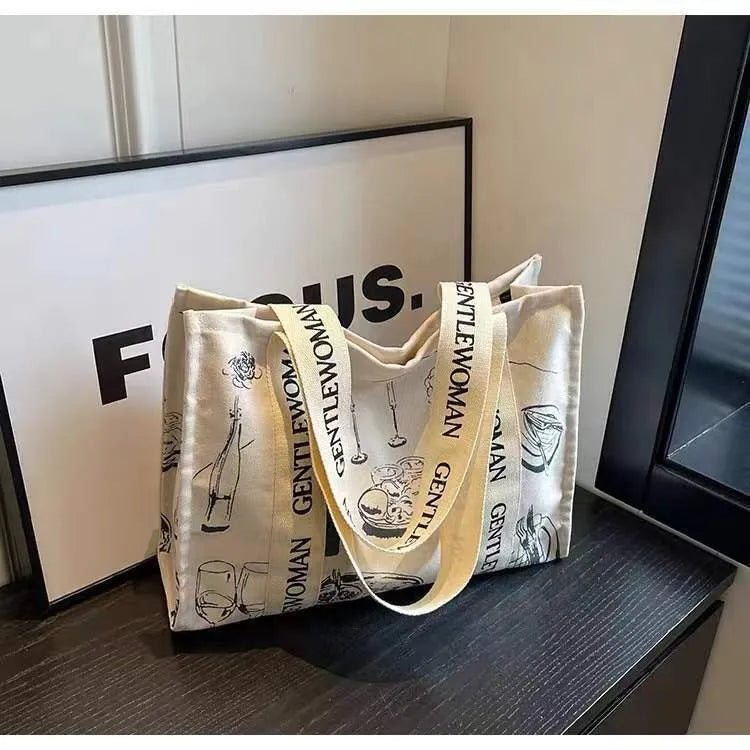 A large canvas tote bag with a printed design, shown in a choice of styles.