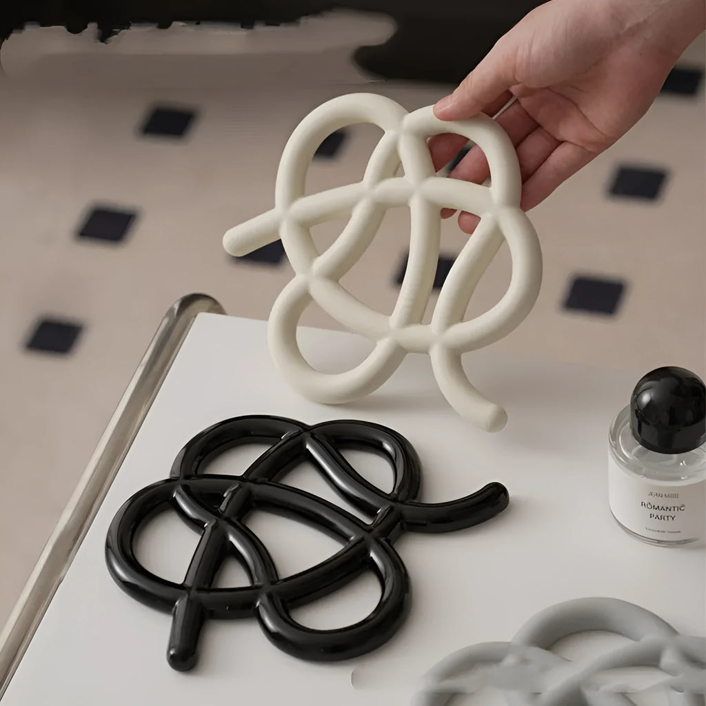 Ceramic heat-resistant pot mat in irregular shape with non-slip silicone pads