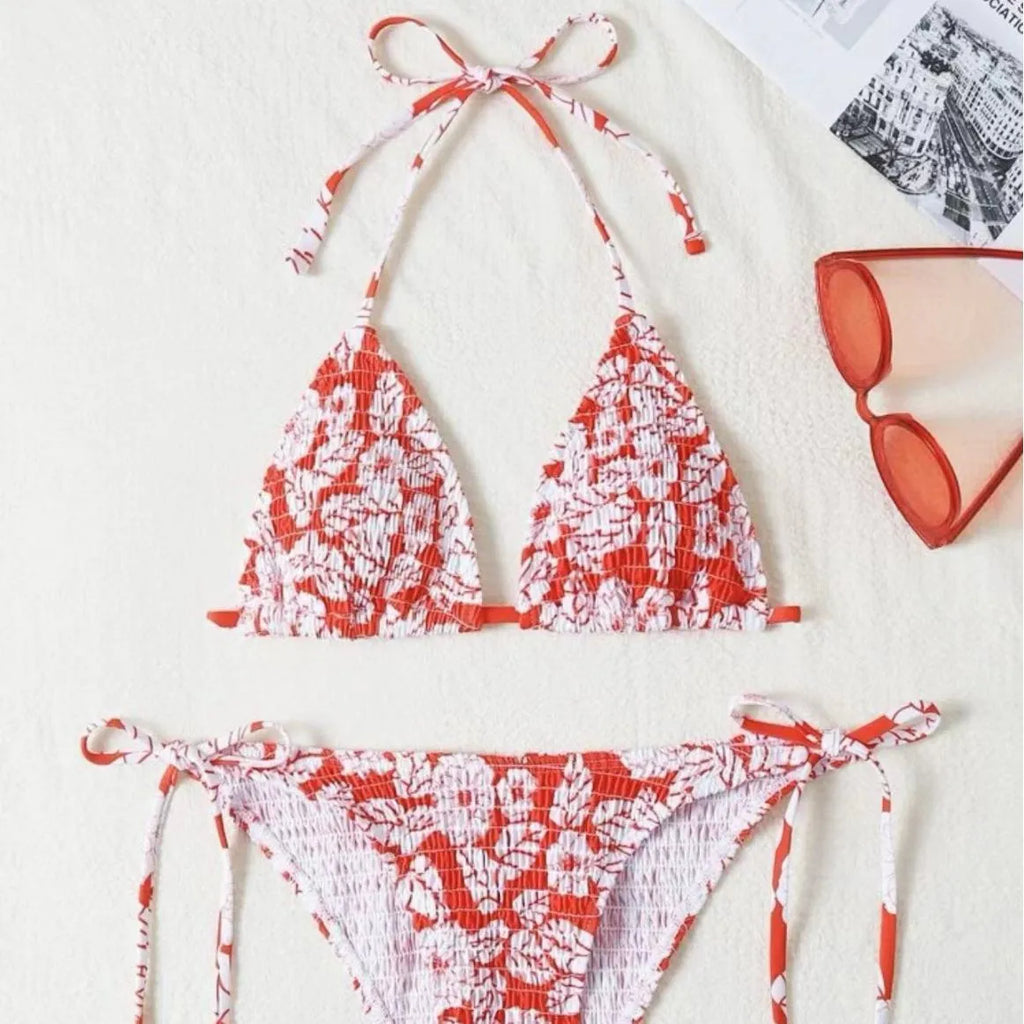 Women's floral print halter swimsuit bikini set in light blue on a mannequin