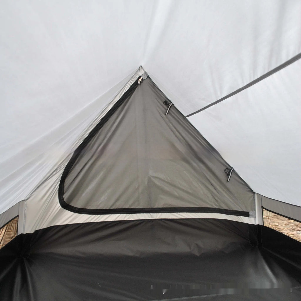Brown or white A-frame pole-free cabin tent erected with hiking cane supports